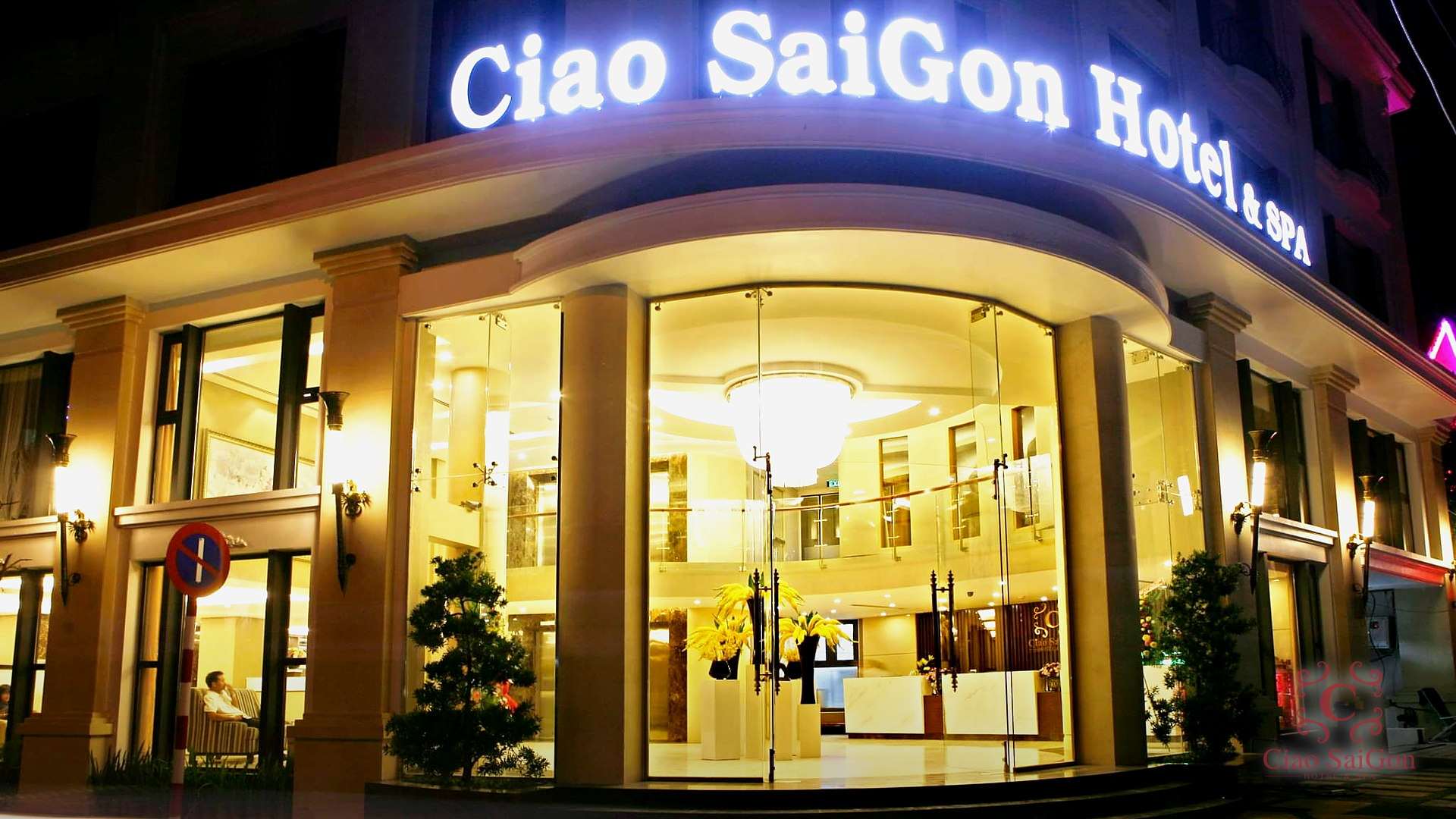 Ciao Saigon Hotel & Spa facade lit up in the evening